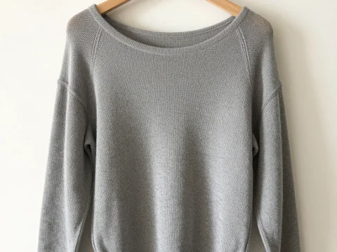 Simple Gray Knit Sweater on Wooden Hanger