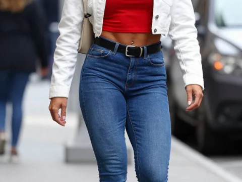 Stylish Woman Walking on City Street in Casual Outfit
