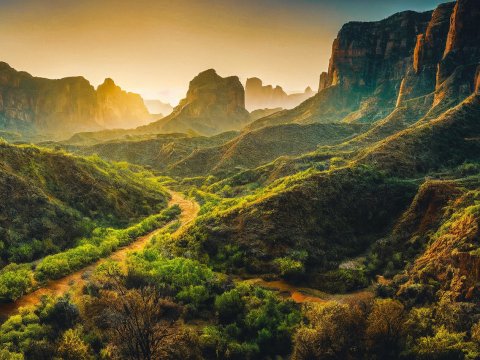 Sunlit Mountain Valley with Lush Greenery
