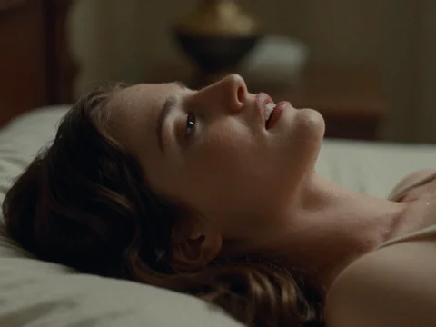 Young Woman in Quiet Rapture Lying on Bed